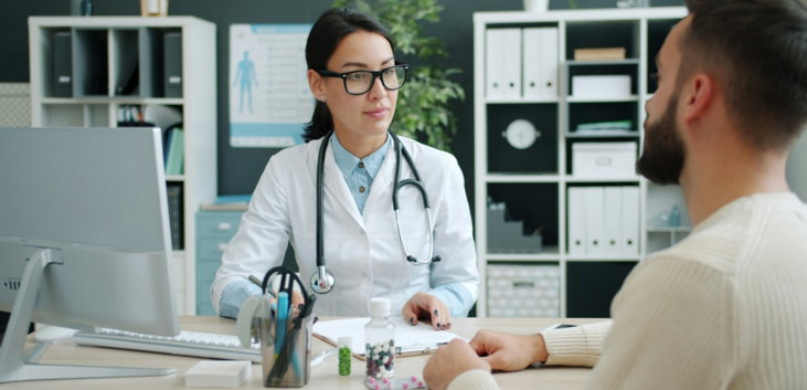 Doctor consults with patient in medical office